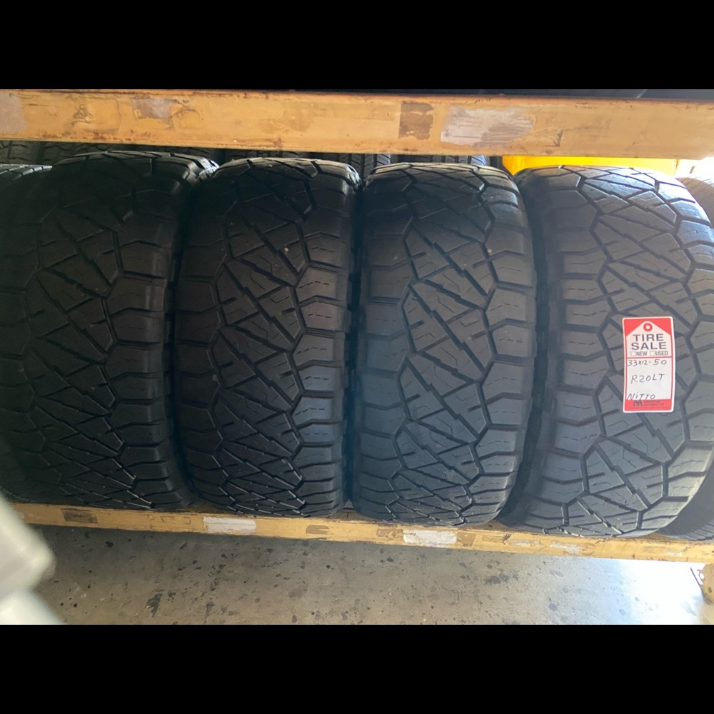 4 like new tires 33x12/50/R20 nitto tires